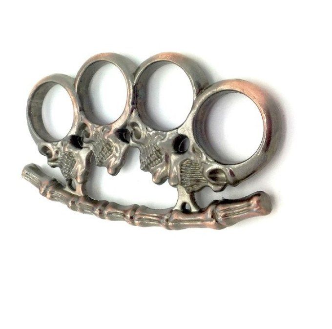 Poing Américain 4 tête de mort sur colonne / cuivré